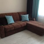 أريكة الأكورديون البني