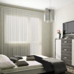 داخل غرفة نوم صغيرة للبالغين مزينة بألوان هادئة.