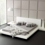 يتم استخدام ظلال مختلفة من اللون الرمادي لتزيين غرفة النوم هذه.